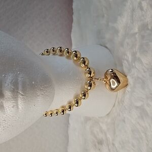 Women jewelery gold beads necklace with detachable heart pendant.